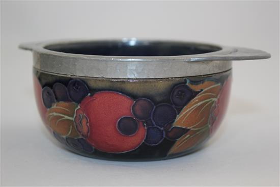 A Moorcroft pomegranate and Tudric pewter mounted quaich, 1920s, 13.8cm